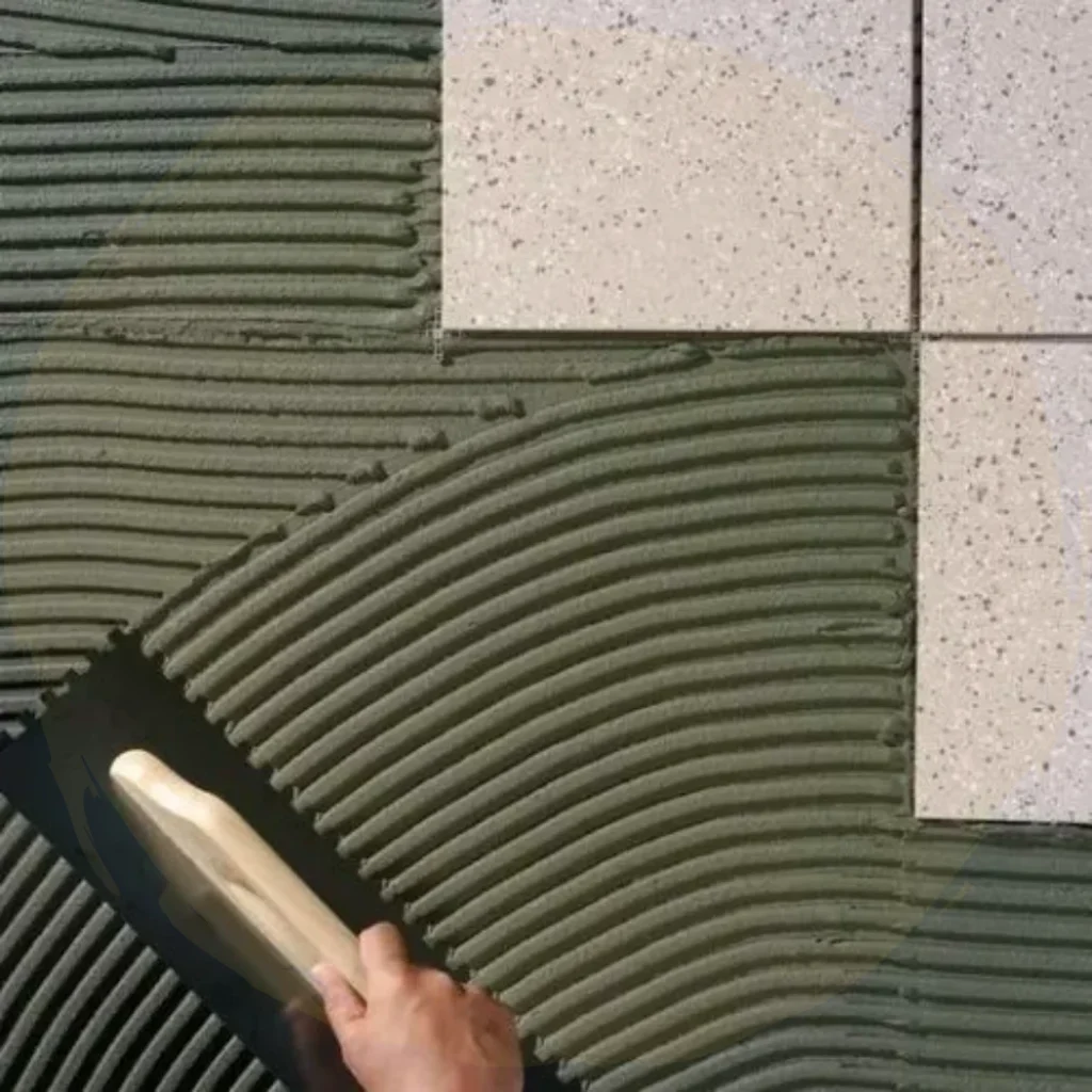 tile adhesive product application on floor tiles